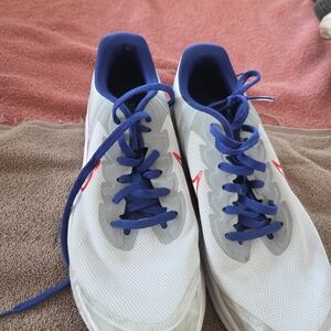 Nike Kids White Sneakers with Blue Accents and Red Swoosh